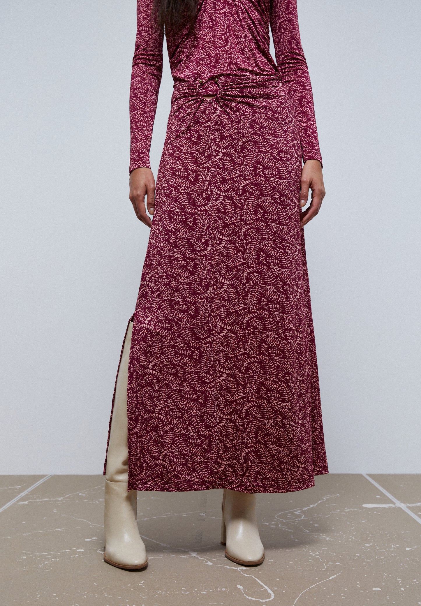 FALDA MIDI DETALLE CINTURA