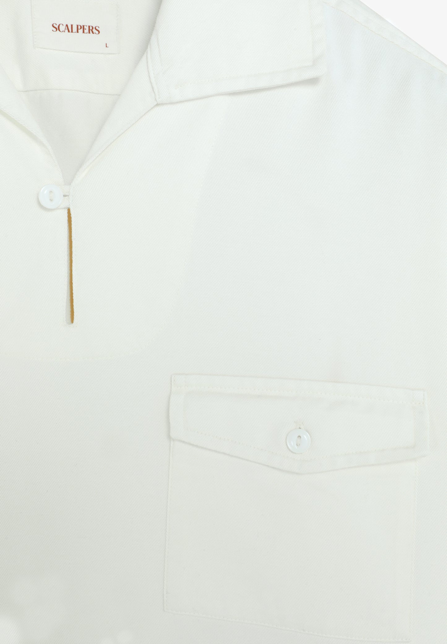 POLERA BOLSILLO CON BOTÓN