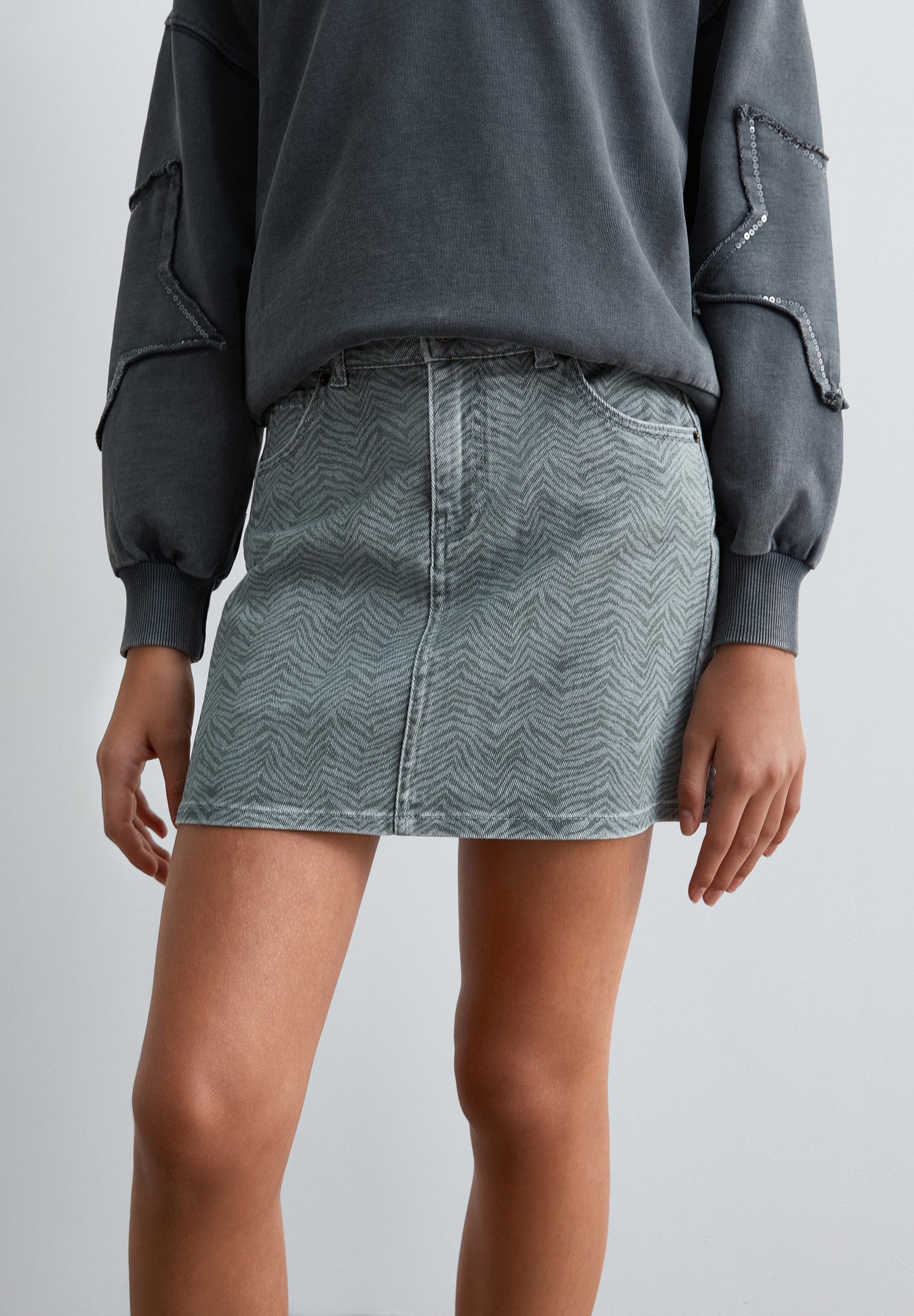 FALDA CORTA DENIM ESTAMPADA