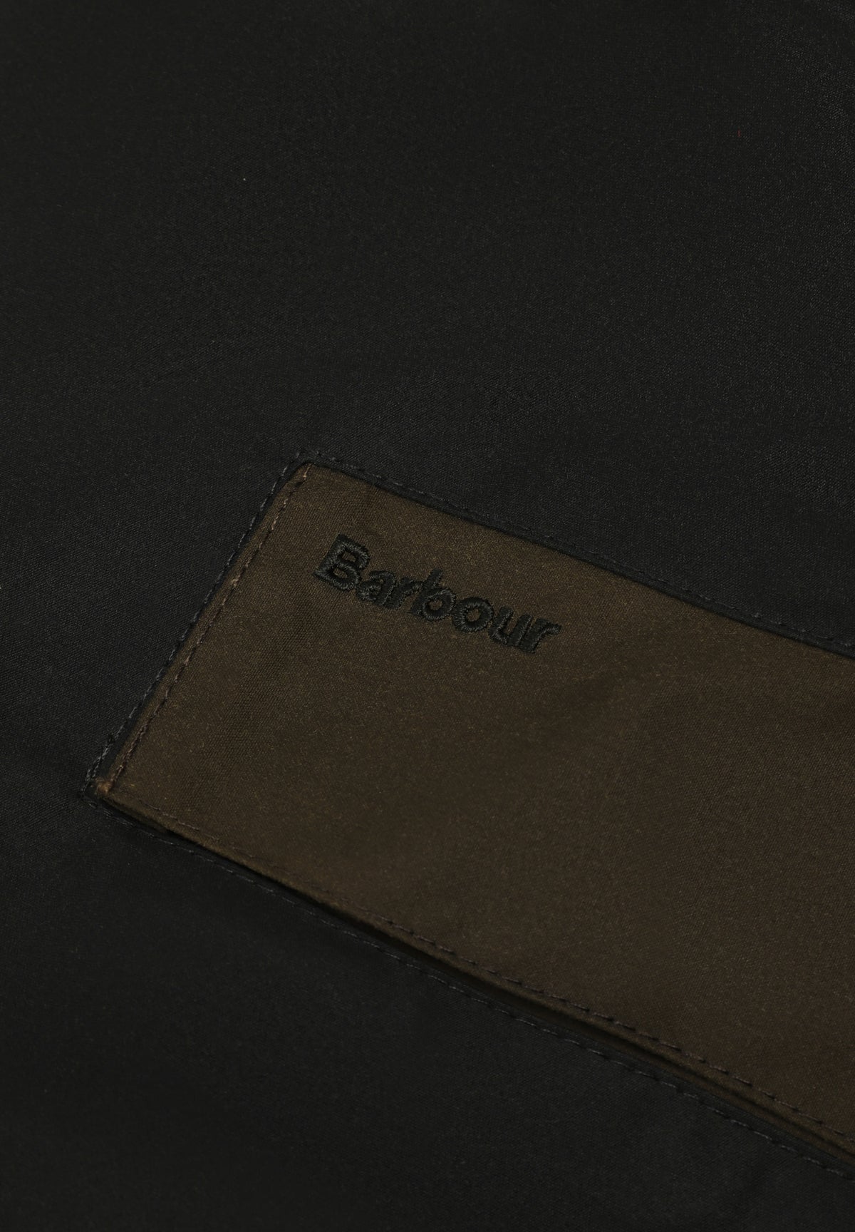 BARBOUR | CHAQUETA ENCERADA PATCHWORK TRANSPORT
