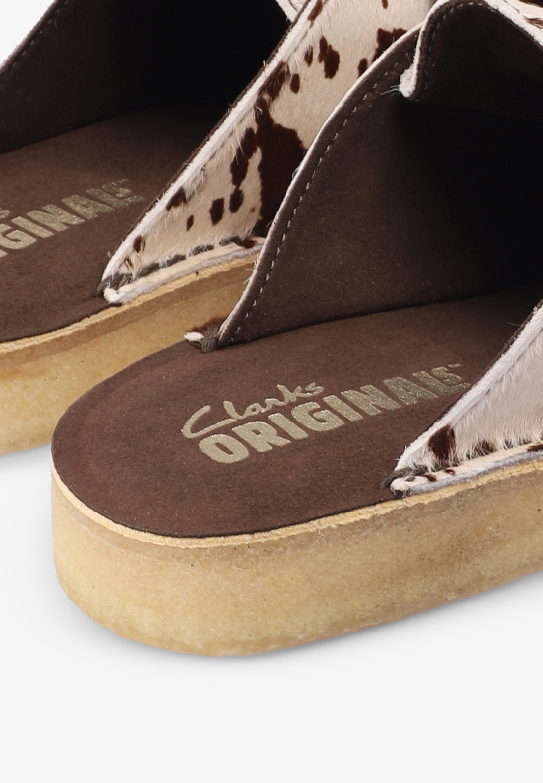 CLARKS | NOMAD MULE COW PRINT